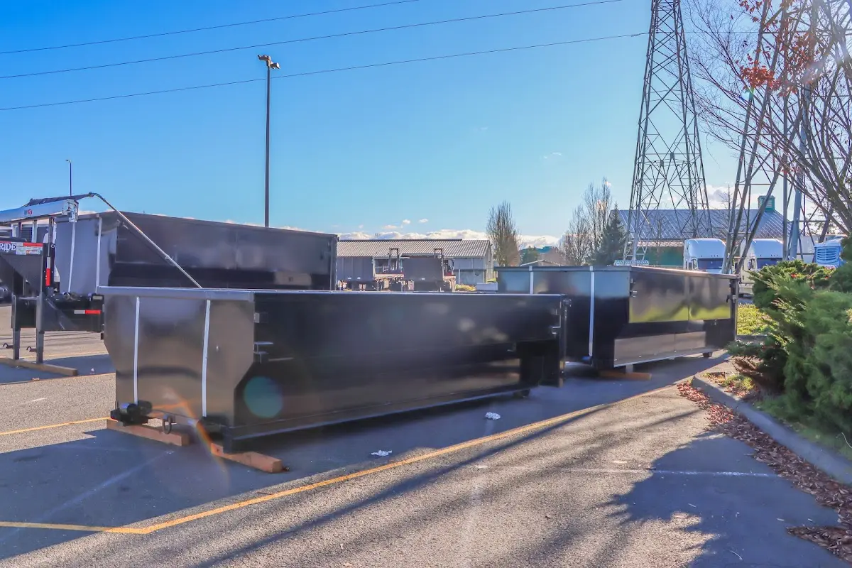 Roll-off dumpster ready for waste disposal at job site for 15 Yard Dumpster Rental in Ocean Springs